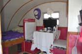 Interior of 1947 Komfort Koach Teardrop Trailer, Showing Bed And Dining Area